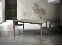 Foto tavolo moderno contemporaneo con struttura in metallo e piano in vetro color tortora