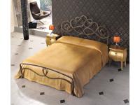 Foto letto matrimoniale in ferro battuto.