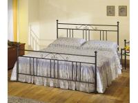 Foto letto matrimoniale in ferro battuto.